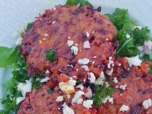 beetroot, carrot and quinoa fritters on salad
