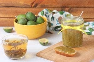 feijoa jam in a jar and on toast beside a bowl of feijoas