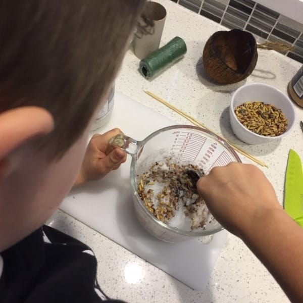 Eli mixing the bird food ingredients